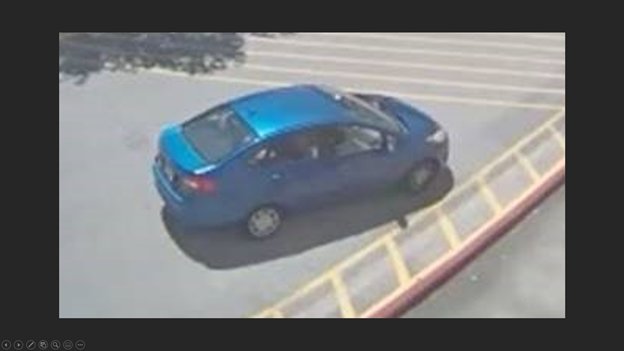 The suspects left the Kroger location in this blue, four-door sedan.